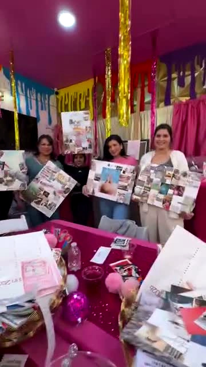 Group of friends showing off their finished vision boards at CHICA