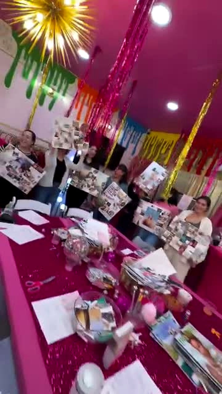 Guests holding up their finished vision boards at a private vision board party at CHICA